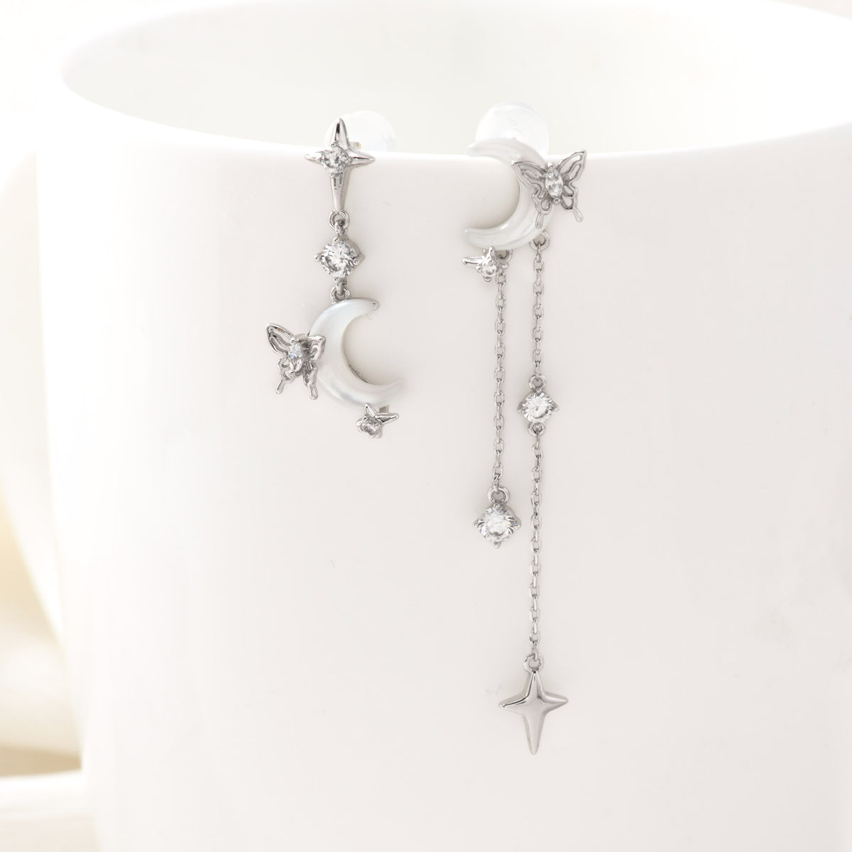 Silver nocturne wings earrings – on white background