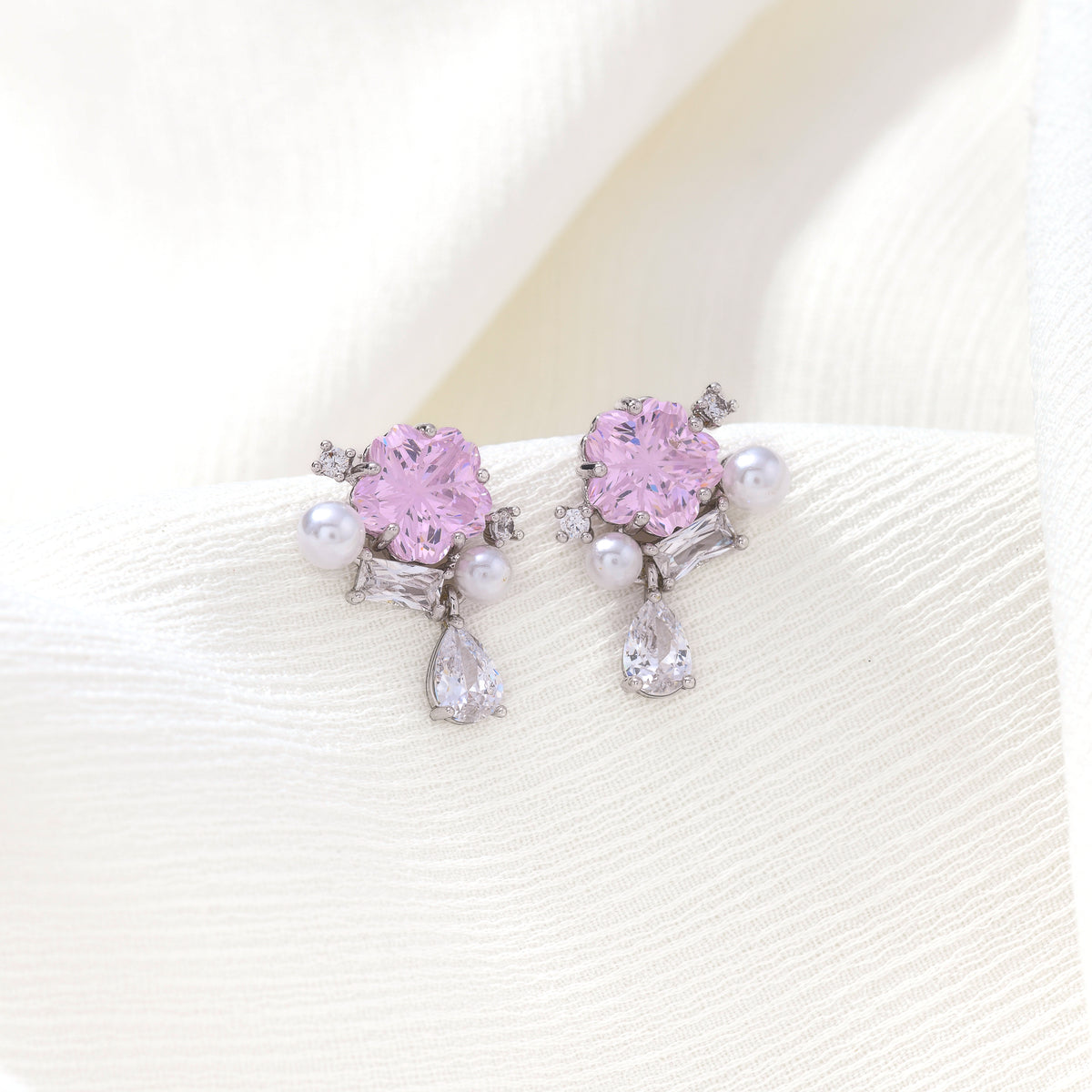 Silver cherry blossom gem studs – on white background