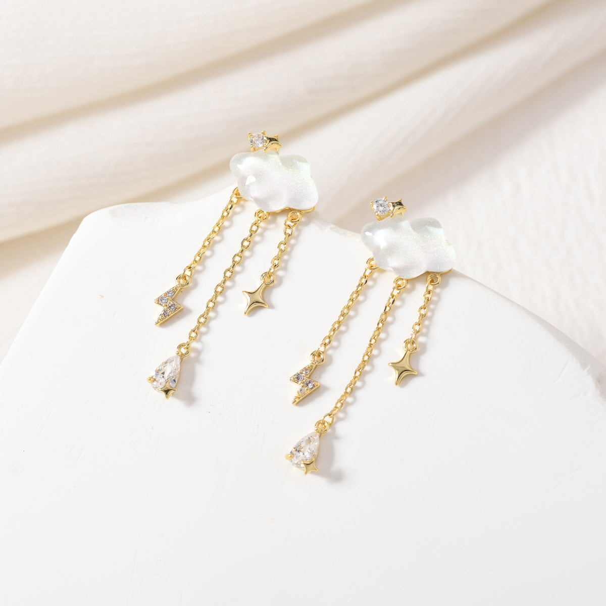 Gold lightning storm earrings – on white background