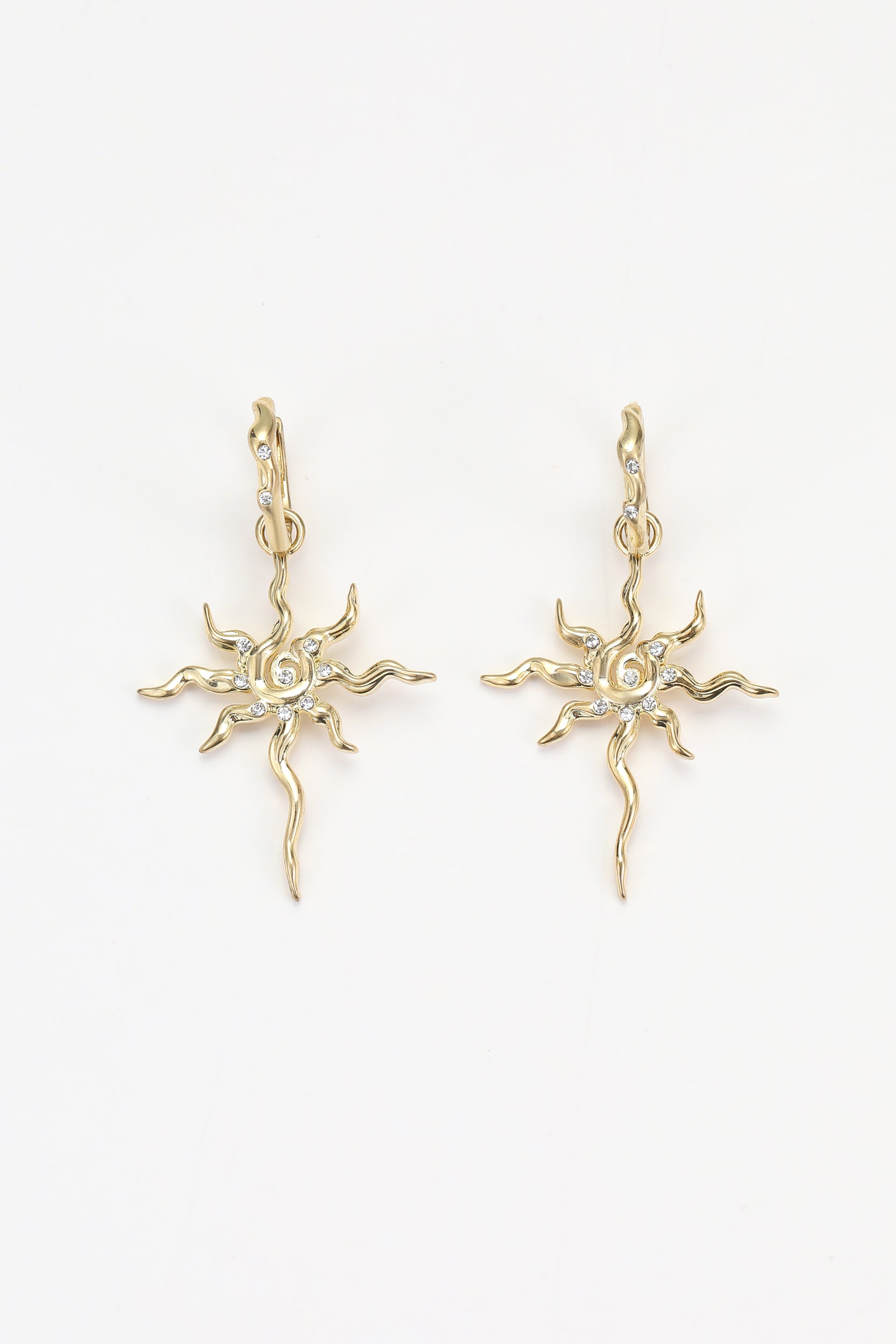 Gold soln earrings – on white background