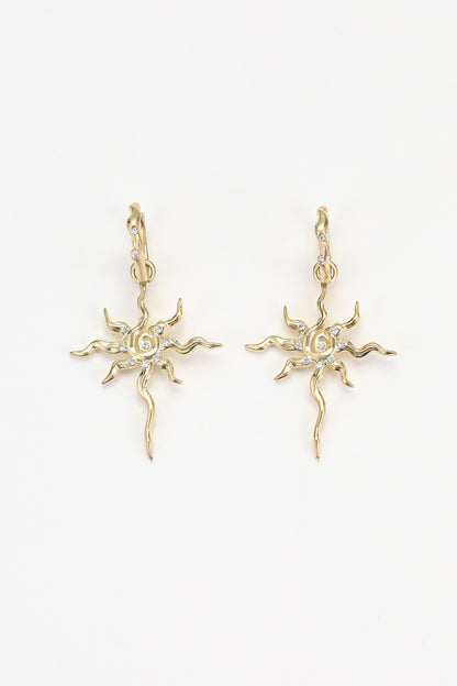 Gold soln earrings – on white background