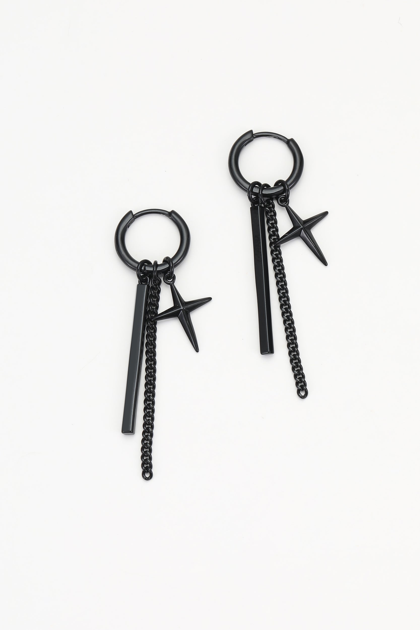 Black rune earrings – on white background