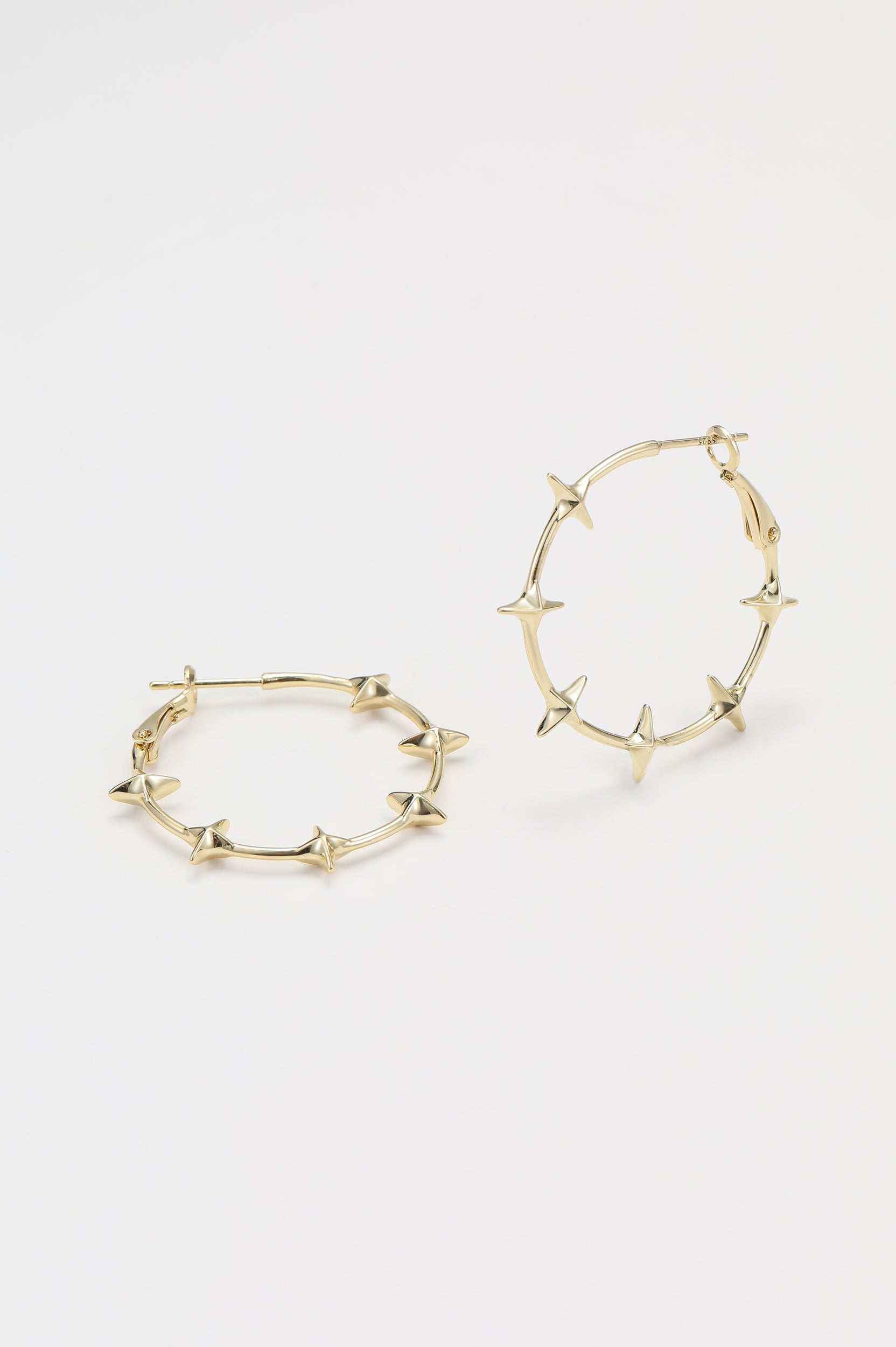 Gold flare earrings – alternate angle