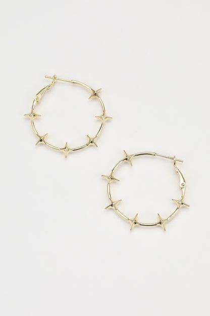 Gold flare earrings – on white background