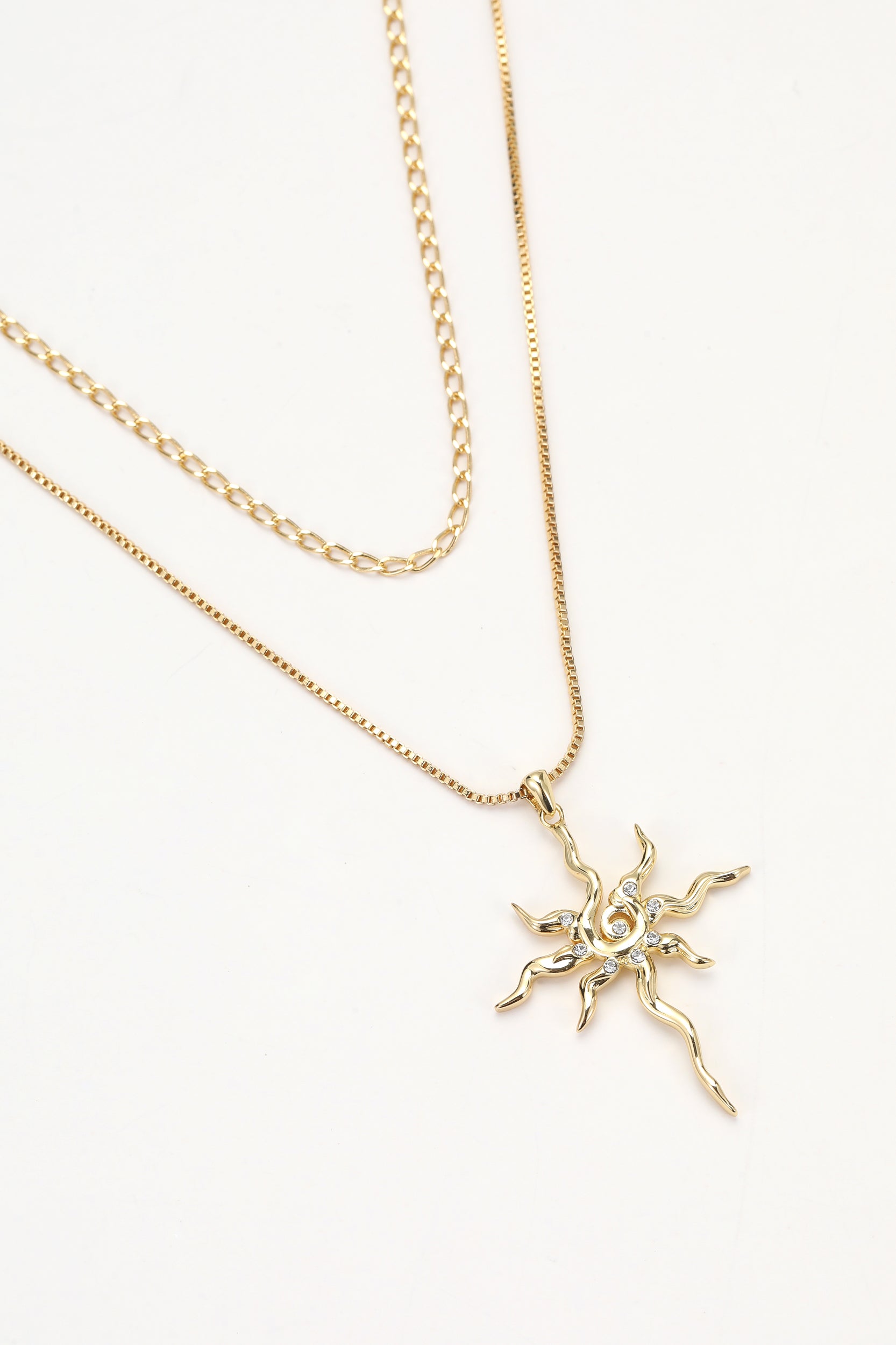 Gold soln necklace – on white background