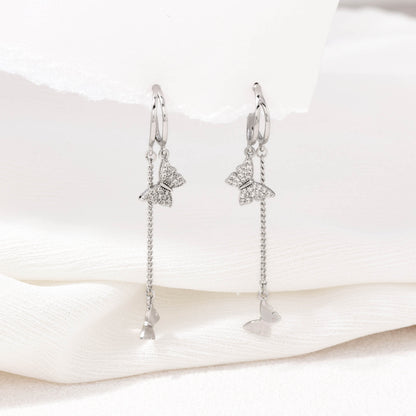 Silver dangling butterfly earrings – alternate angle