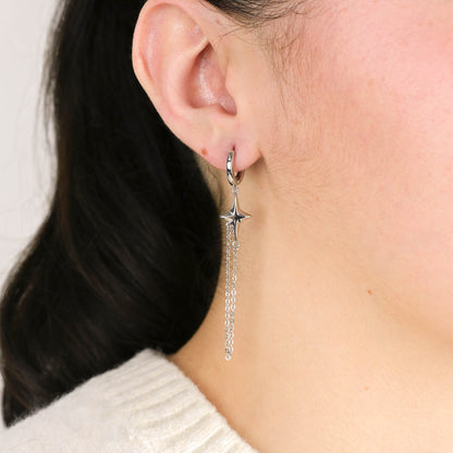 Silver asymmetric 4-point star earrings – alternate angle