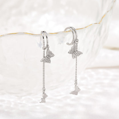 Silver dangling butterfly earrings – detail view