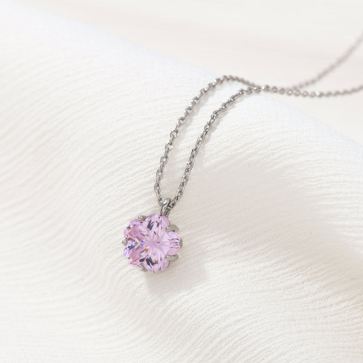 Silver cherry blossom gem necklace – on white background