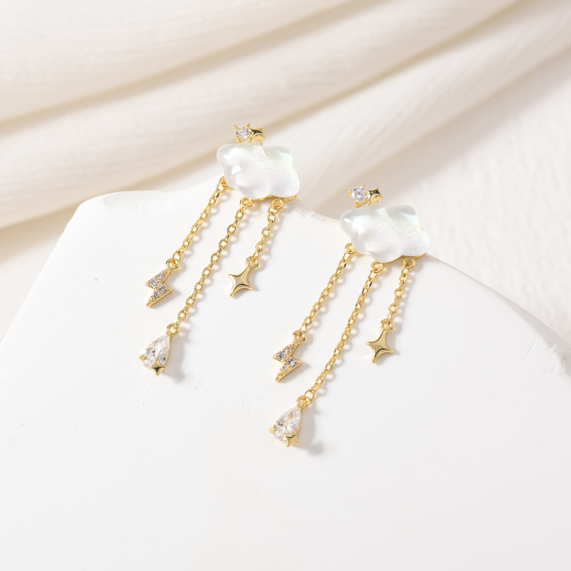 Gold lightning storm earrings – on white background